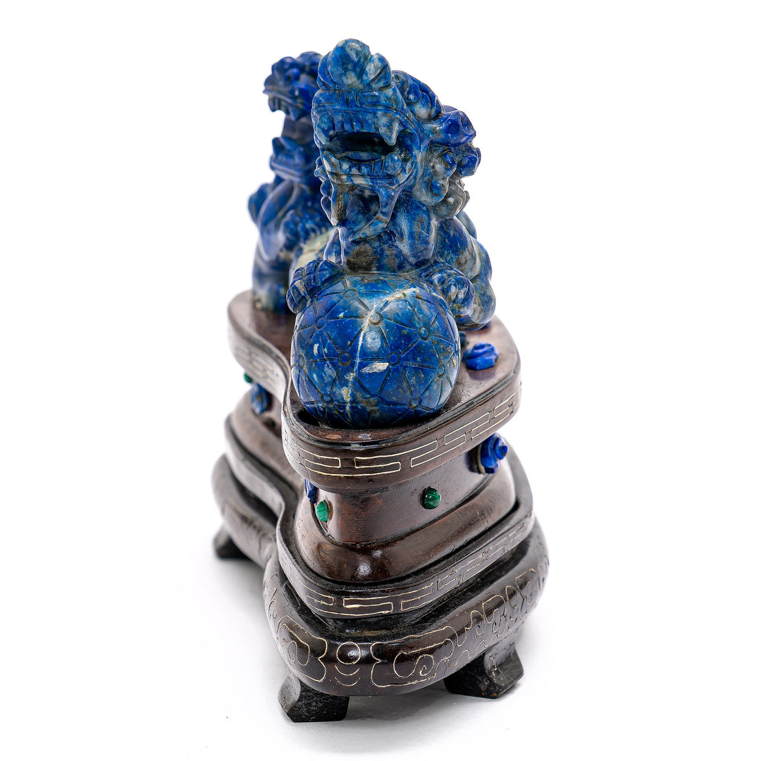Hand-carved lapis Fu Lions symbolizing protection.