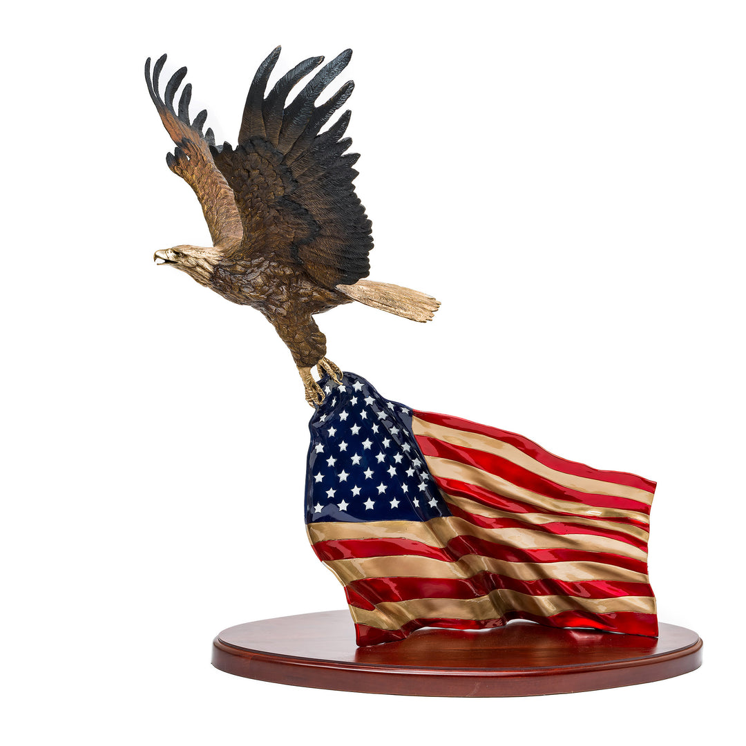 Majestic bronze eagle sculpture gripping the American flag