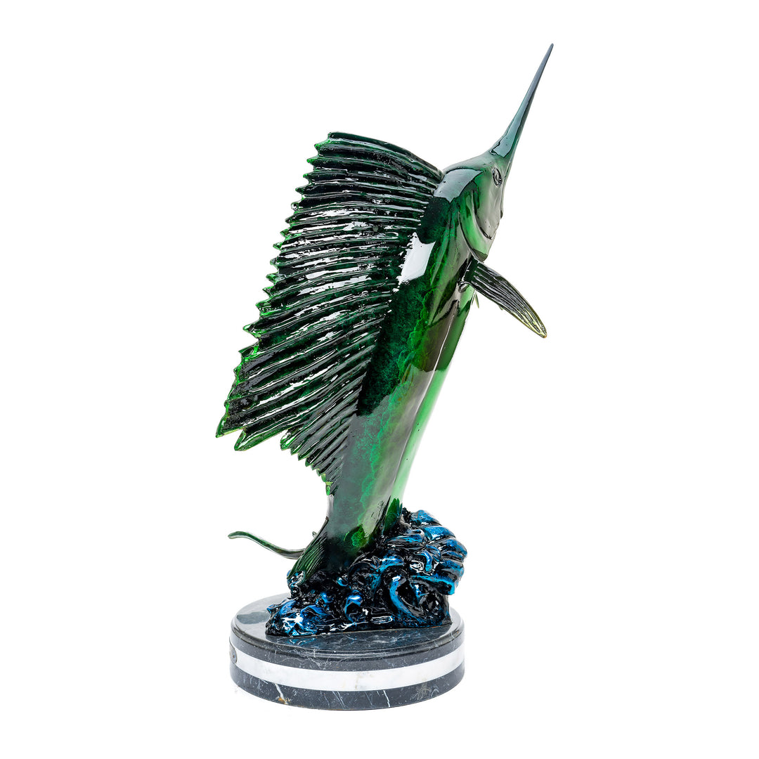 Dynamic bronze marlin leaping from the ocean, mounted on marble.