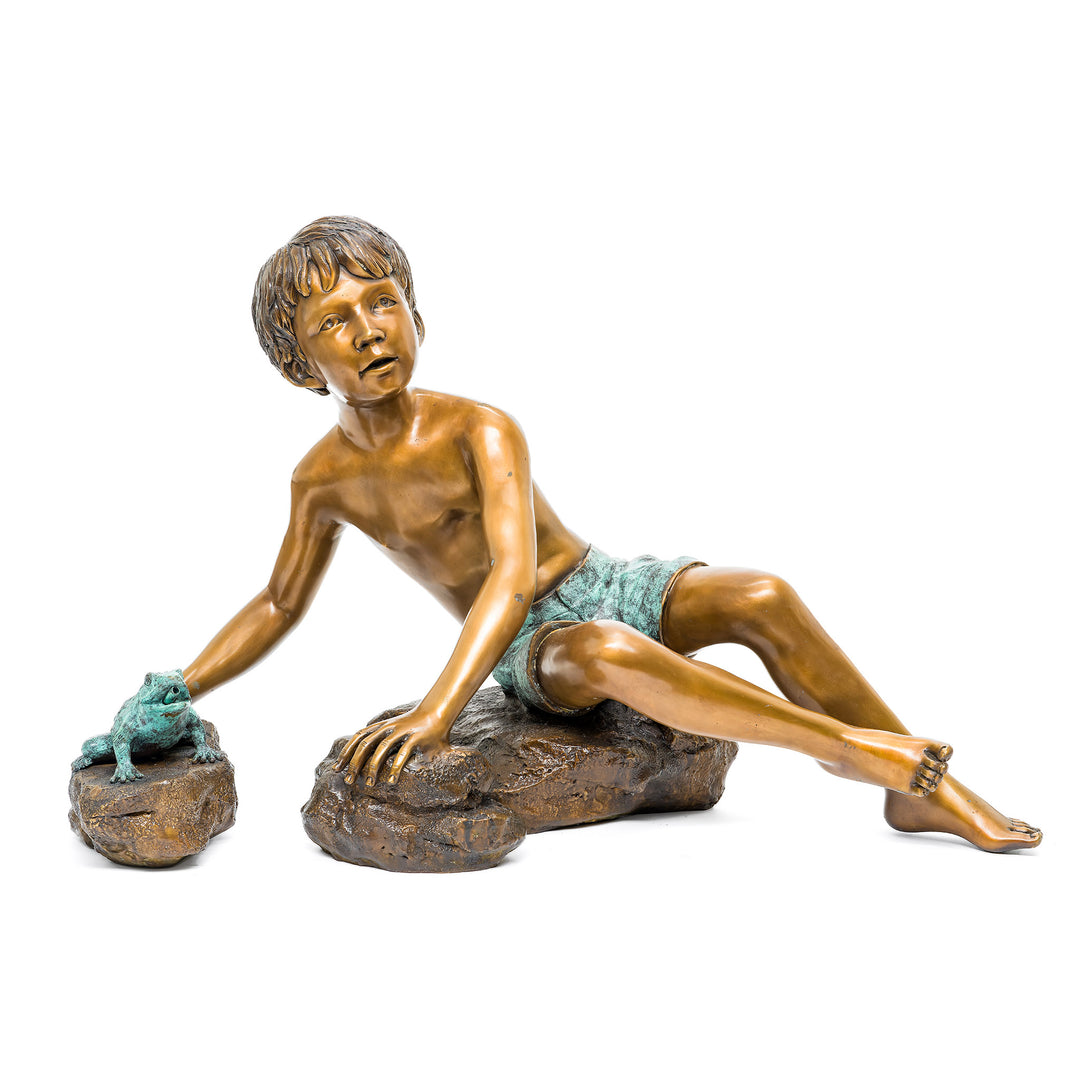 Bronze boy and frog fountain with flowing water
