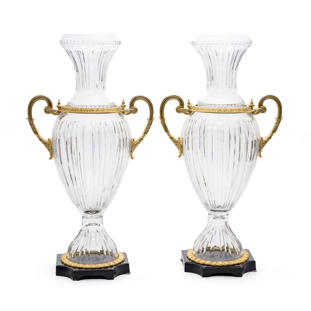 Elegant crystal and bronze urns with gilded handles