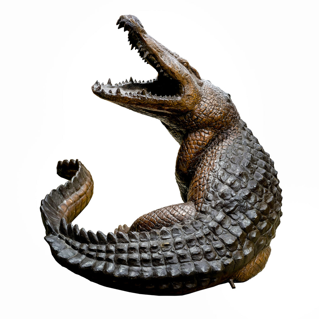 Bronze crocodile fountain with water flowing from its mouth