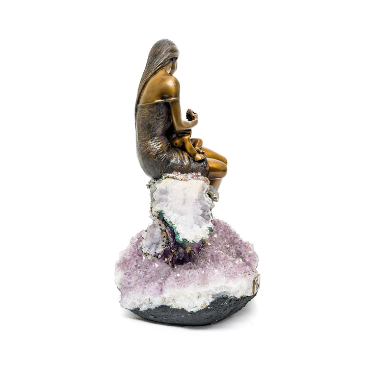 Amethyst crystal base supporting nurturing mother sculpture