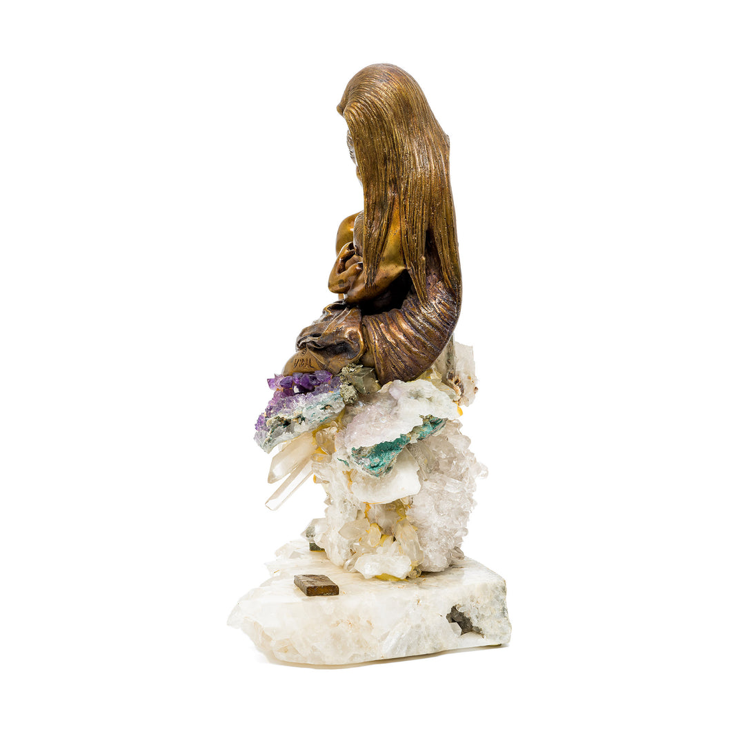 Side angle of unified bronze figures seated on amethyst