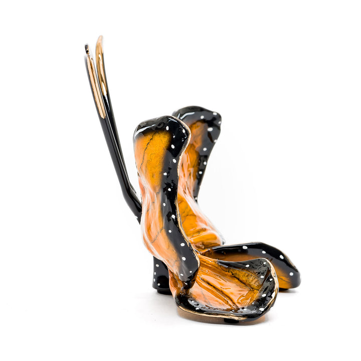 Compact bronze monarch butterfly with sculpted wings