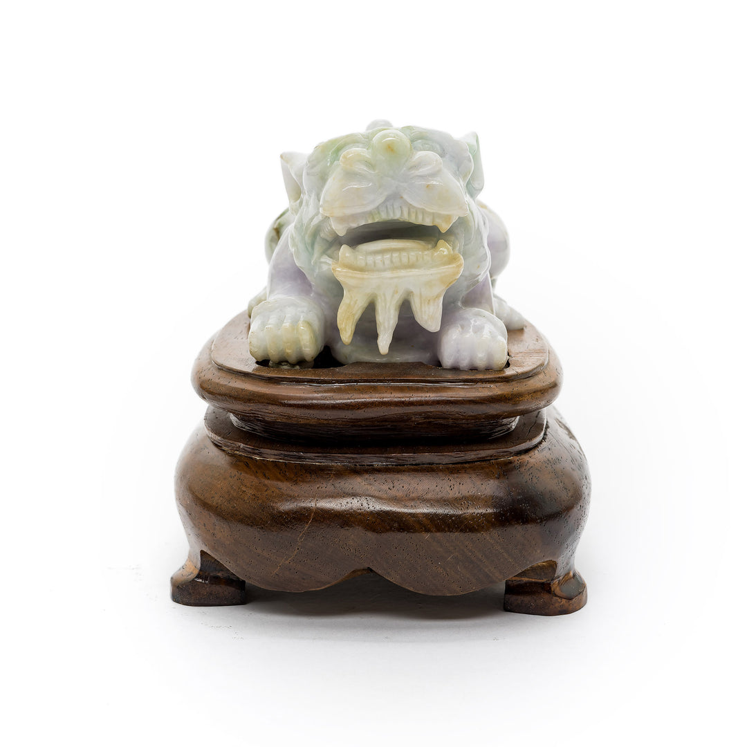 Front-facing jade Fu Dog with open mouth and detailed teeth