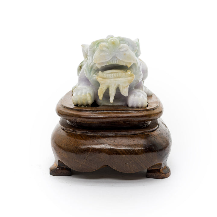 Front-facing jade Fu Dog with open mouth and detailed teeth