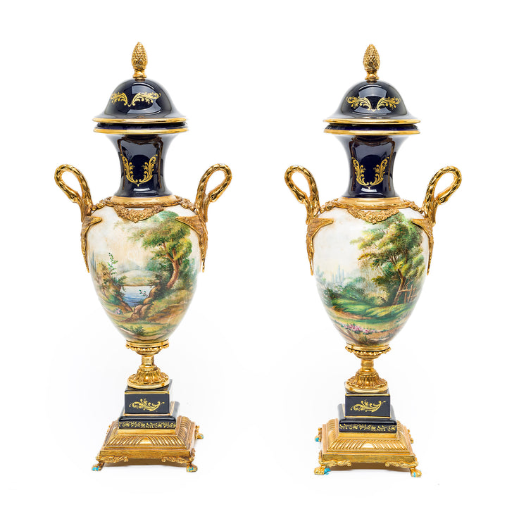 Elegant cobalt blue and gold Sevres-style urns with ormolu mounts
