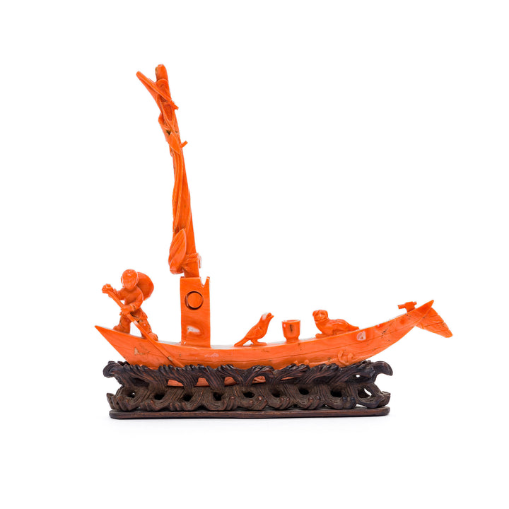 Coral boat sculpture with fisherman and birds