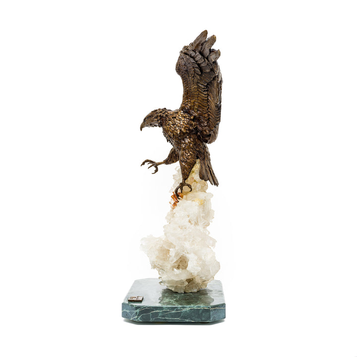 Side angle of eagle sculpture showing talons and descent posture