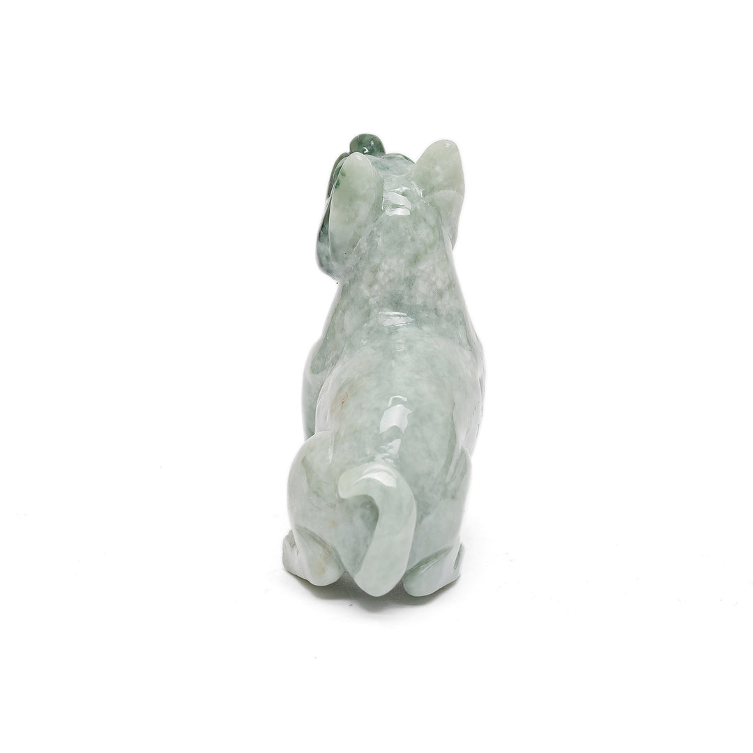 Jade animal carving of alert dog in repose