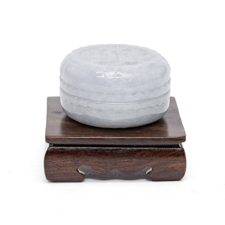 Carved jade jewelry box with lid and wooden base