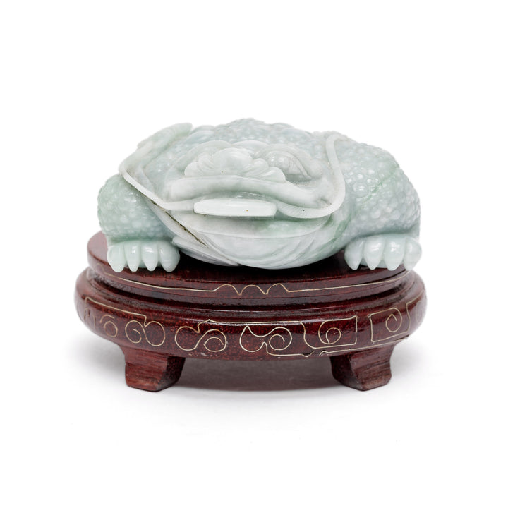 Jade money toad sculpture with coin on wood base