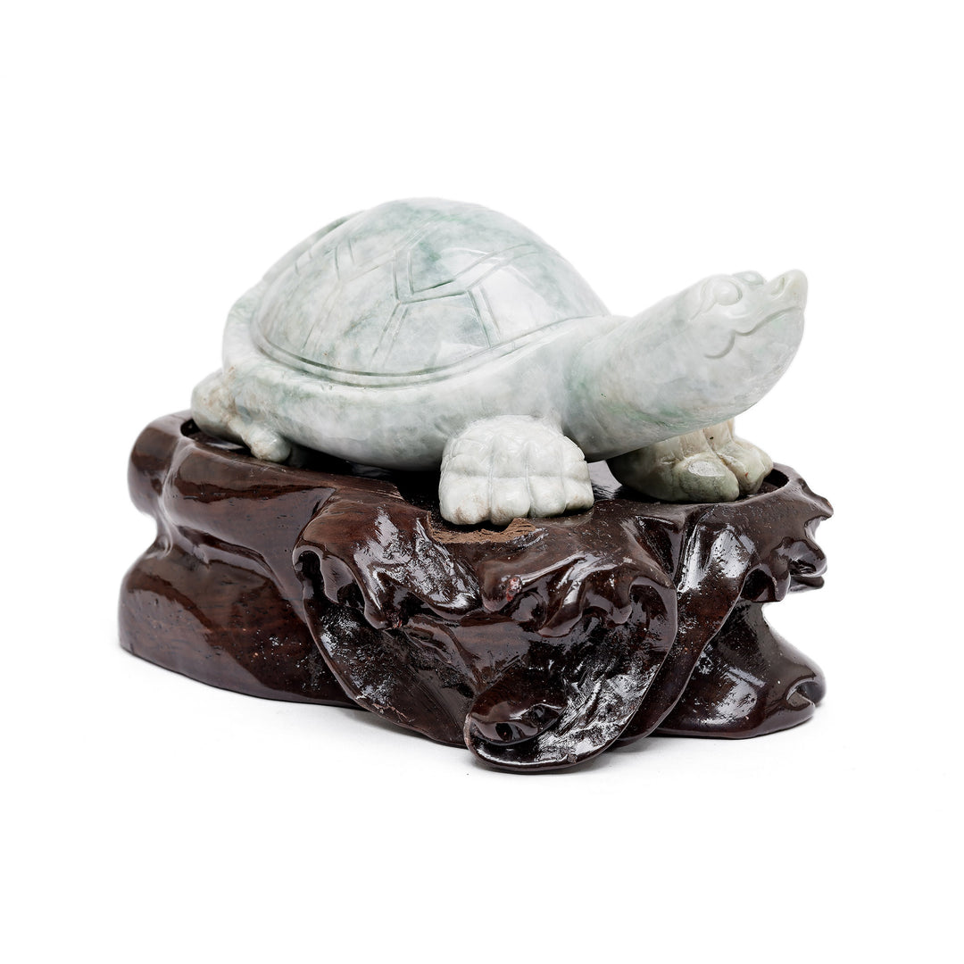 Jade turtle sculpture on wood base