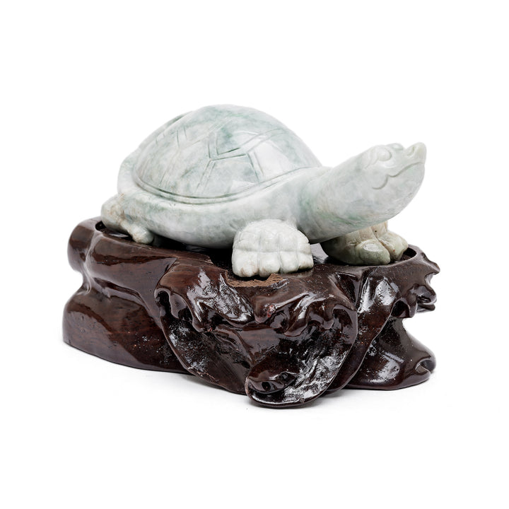 Jade turtle sculpture on wood base