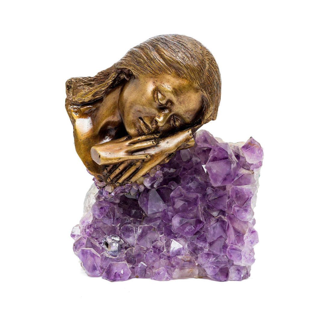 Front view of Lady Relaxing I bronze sculpture resting on amethyst