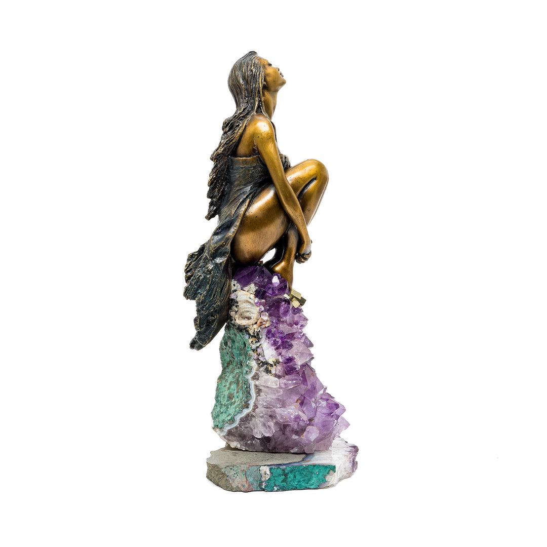 Left profile of sculpture showing amethyst and green mineral rock