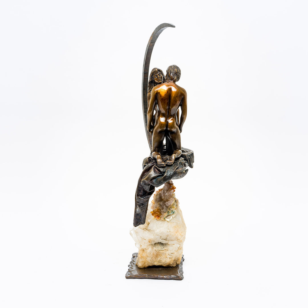 Side angle showing couple's intimate pose and lunar arch