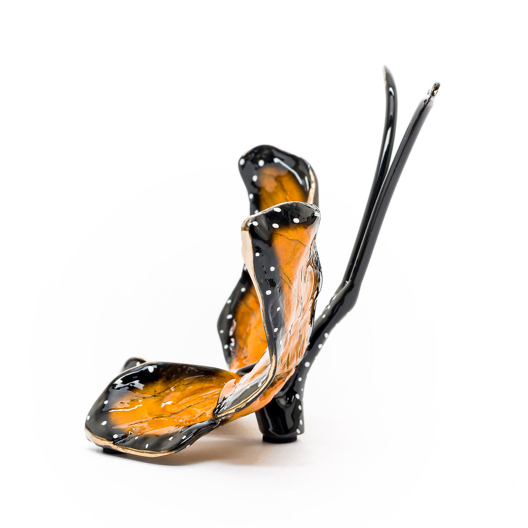 Side view of glossy monarch butterfly figurine