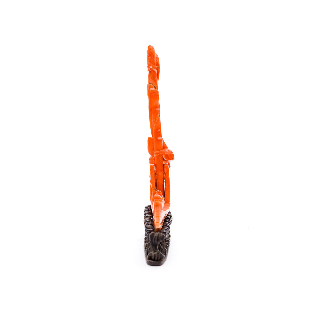 Natural red coral carving on wave base