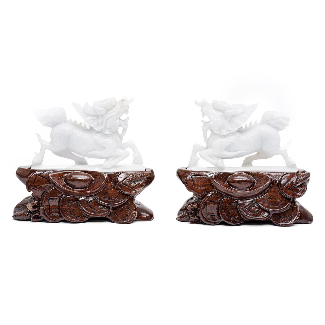 Pair of jade dragon sculptures on wood bases