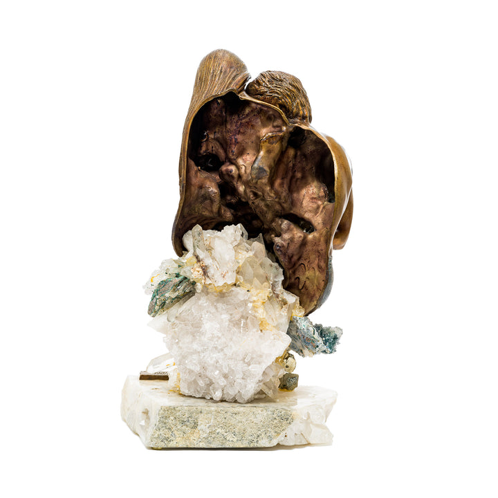 Back view of intimate bronze family sculpture on gemstone base