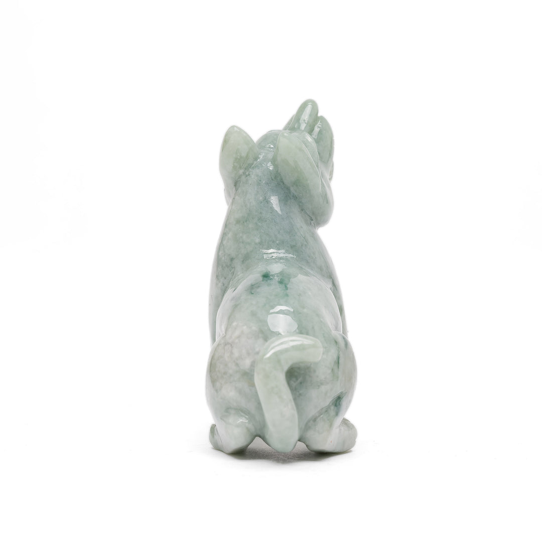 Rear view of jade dog statue with curled tail