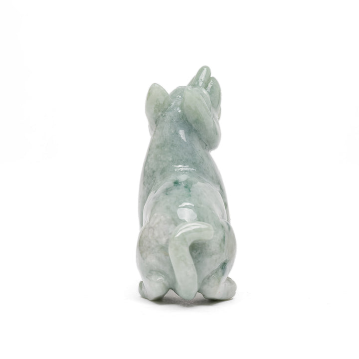 Rear view of jade dog statue with curled tail