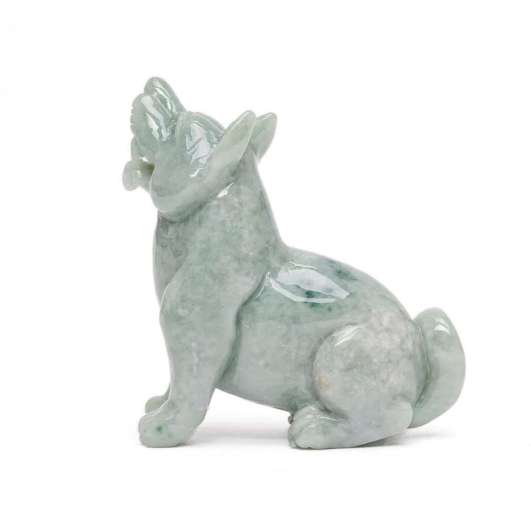 Side profile of jade dog in howling stance