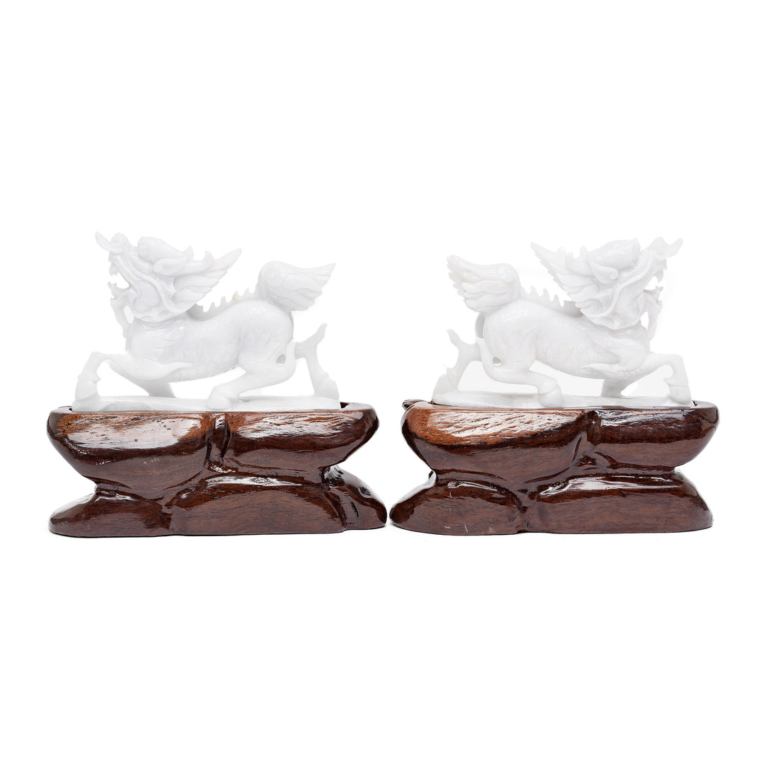 Side view of carved white jade dragons
