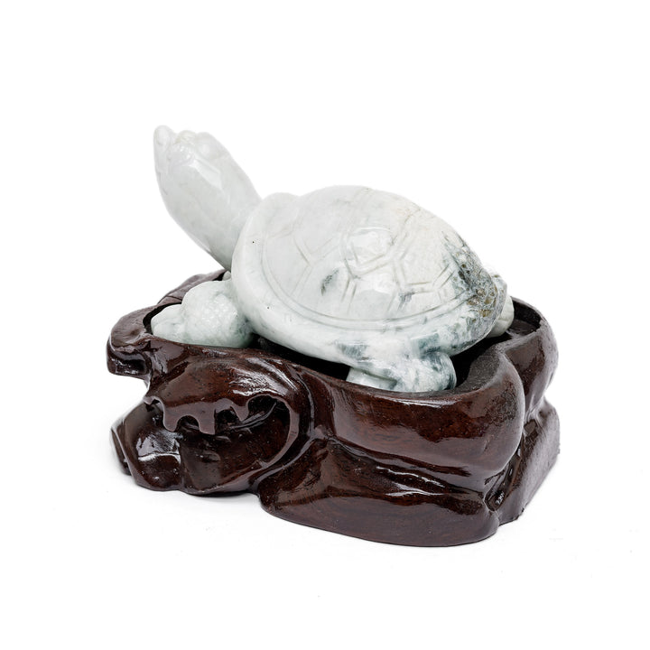 Side view of jade turtle figure in green stone