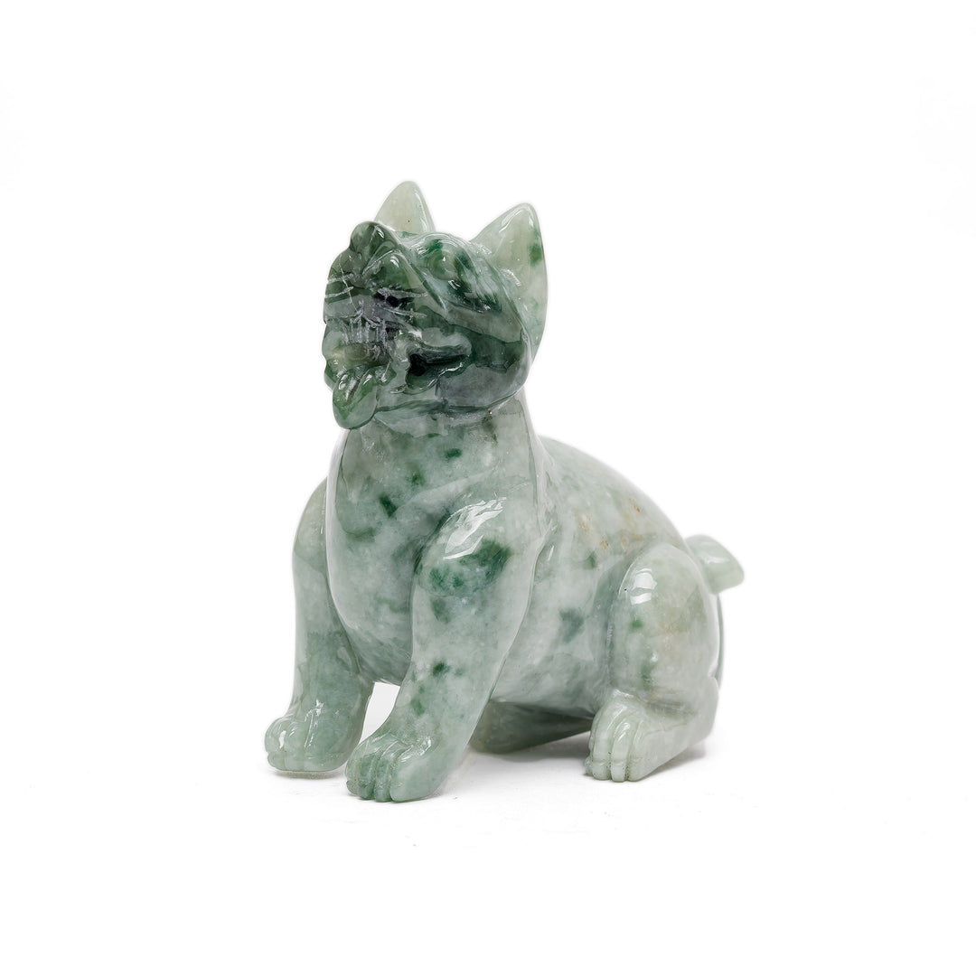 Sitting jade dog sculpture in green stone