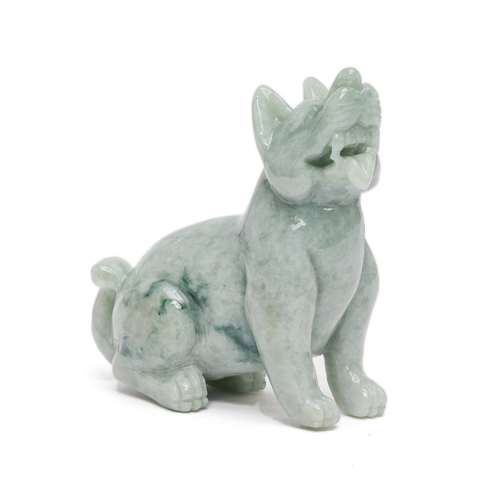 Sitting jade dog sculpture with raised head