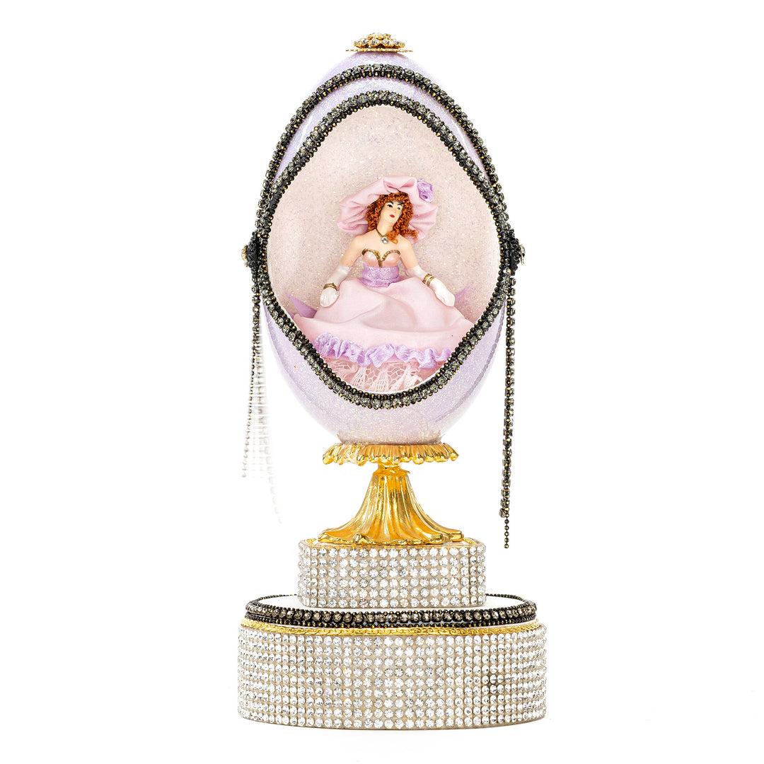 The Egg Fantasy Lavender Victorian Lady Egg part of the  exquisite Egg Fantasy collection is handcrafted in the USA from natural ostrich, emu, goose, duck, and quail eggs. Image
