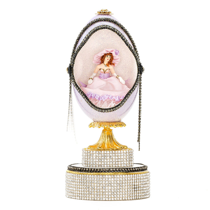 The Egg Fantasy Lavender Victorian Lady Egg part of the  exquisite Egg Fantasy collection is handcrafted in the USA from natural ostrich, emu, goose, duck, and quail eggs. Image