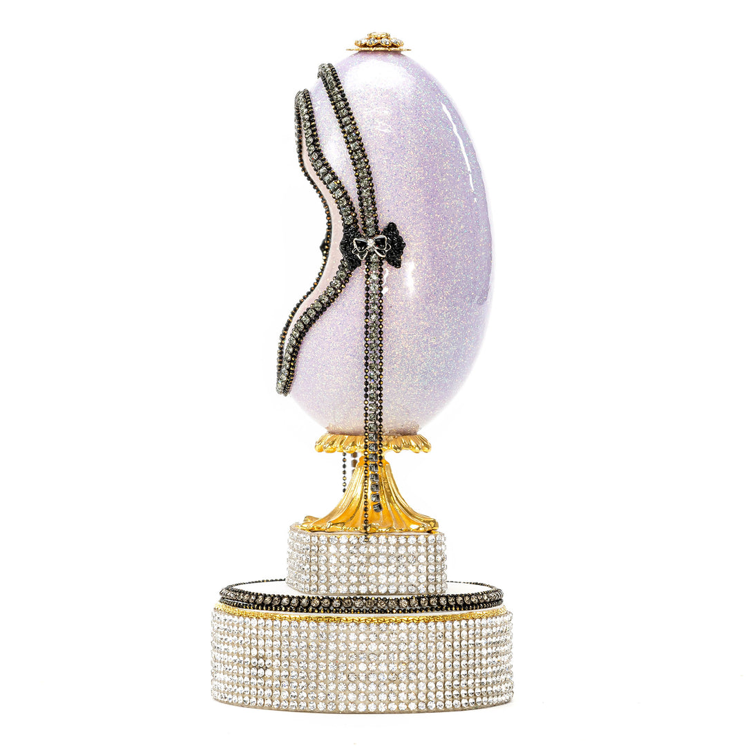 The Egg Fantasy Lavender Victorian Lady Egg part of the  exquisite Egg Fantasy collection is handcrafted in the USA from natural ostrich, emu, goose, duck, and quail eggs. Image