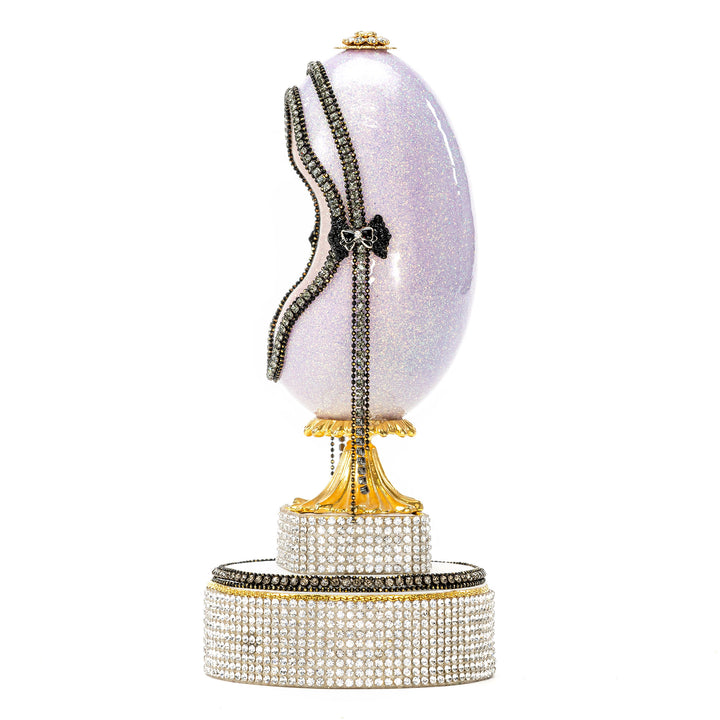 The Egg Fantasy Lavender Victorian Lady Egg part of the  exquisite Egg Fantasy collection is handcrafted in the USA from natural ostrich, emu, goose, duck, and quail eggs. Image
