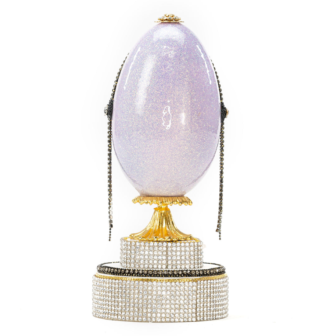 The Egg Fantasy Lavender Victorian Lady Egg part of the  exquisite Egg Fantasy collection is handcrafted in the USA from natural ostrich, emu, goose, duck, and quail eggs. Image