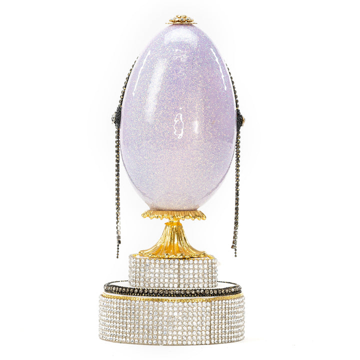 The Egg Fantasy Lavender Victorian Lady Egg part of the  exquisite Egg Fantasy collection is handcrafted in the USA from natural ostrich, emu, goose, duck, and quail eggs. Image