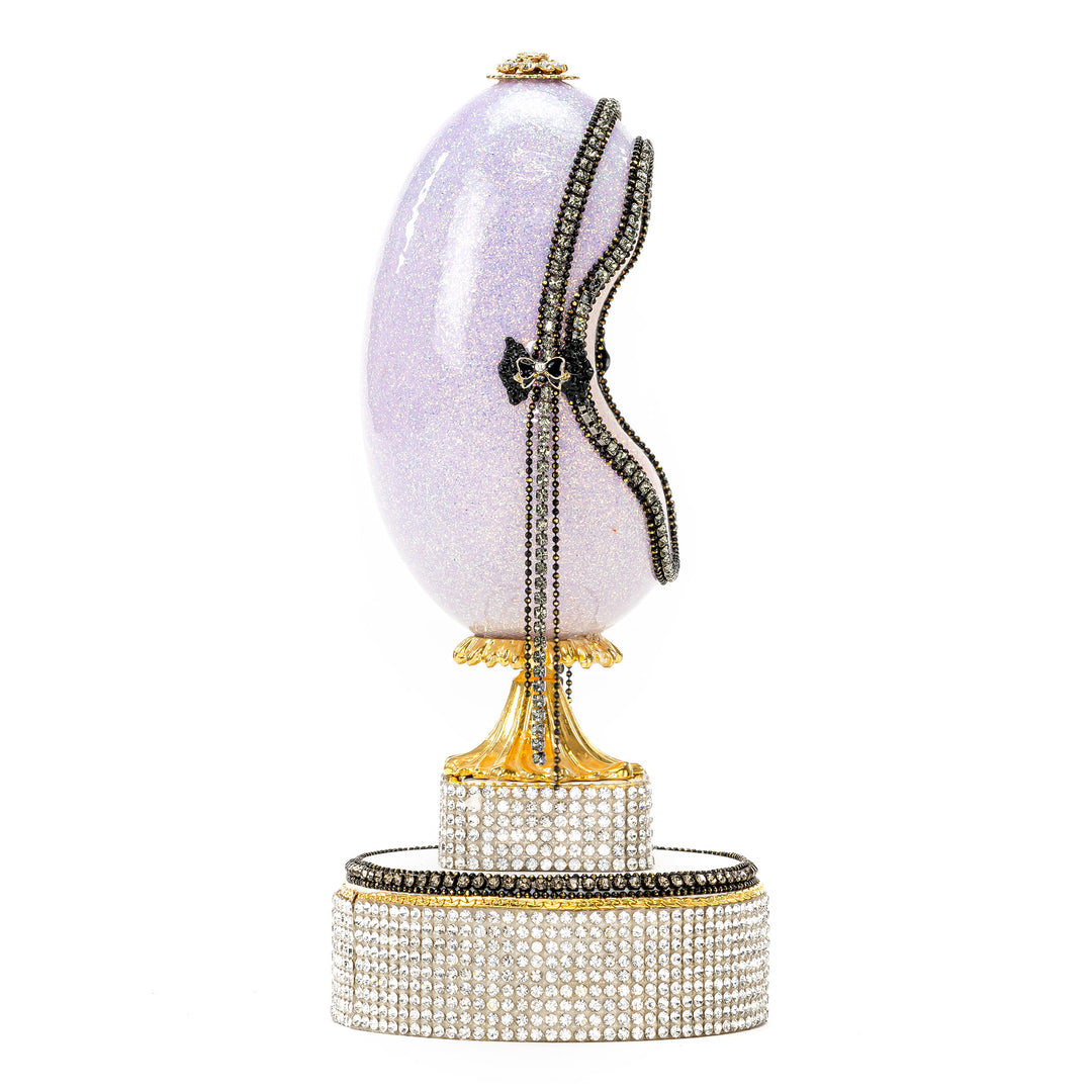 The Egg Fantasy Lavender Victorian Lady Egg part of the  exquisite Egg Fantasy collection is handcrafted in the USA from natural ostrich, emu, goose, duck, and quail eggs. Image