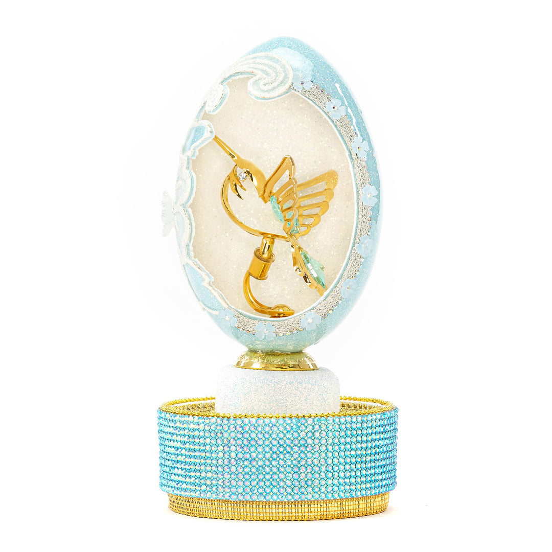 The Egg Fantasy Goose Egg on Crystal Stand XXI part of the  exquisite Egg Fantasy collection is handcrafted in the USA from natural ostrich, emu, goose, duck, and quail eggs. Image