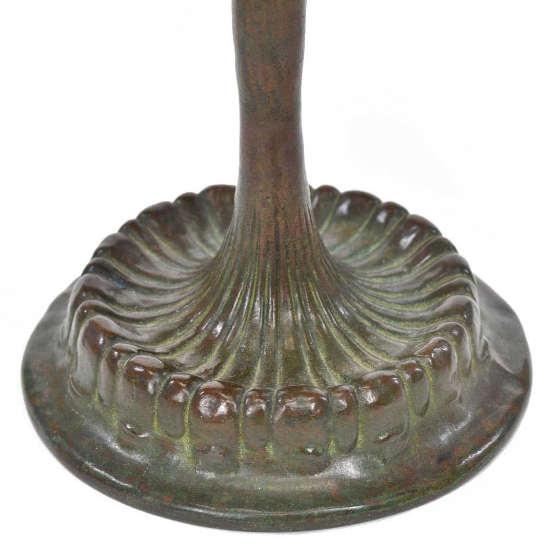 Elegant bronze candle lamp with green blown glass by Tiffany Studios.