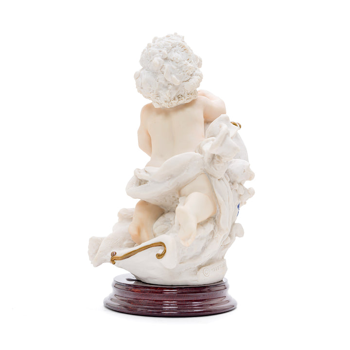 Cherub pouring water porcelain sculpture representing Aquarius sign.