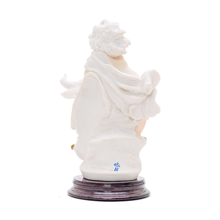 Cherub riding a bull porcelain sculpture representing Taurus sign.