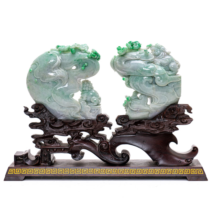 Cultural jade sculptures with smoke plumes rising from incense.