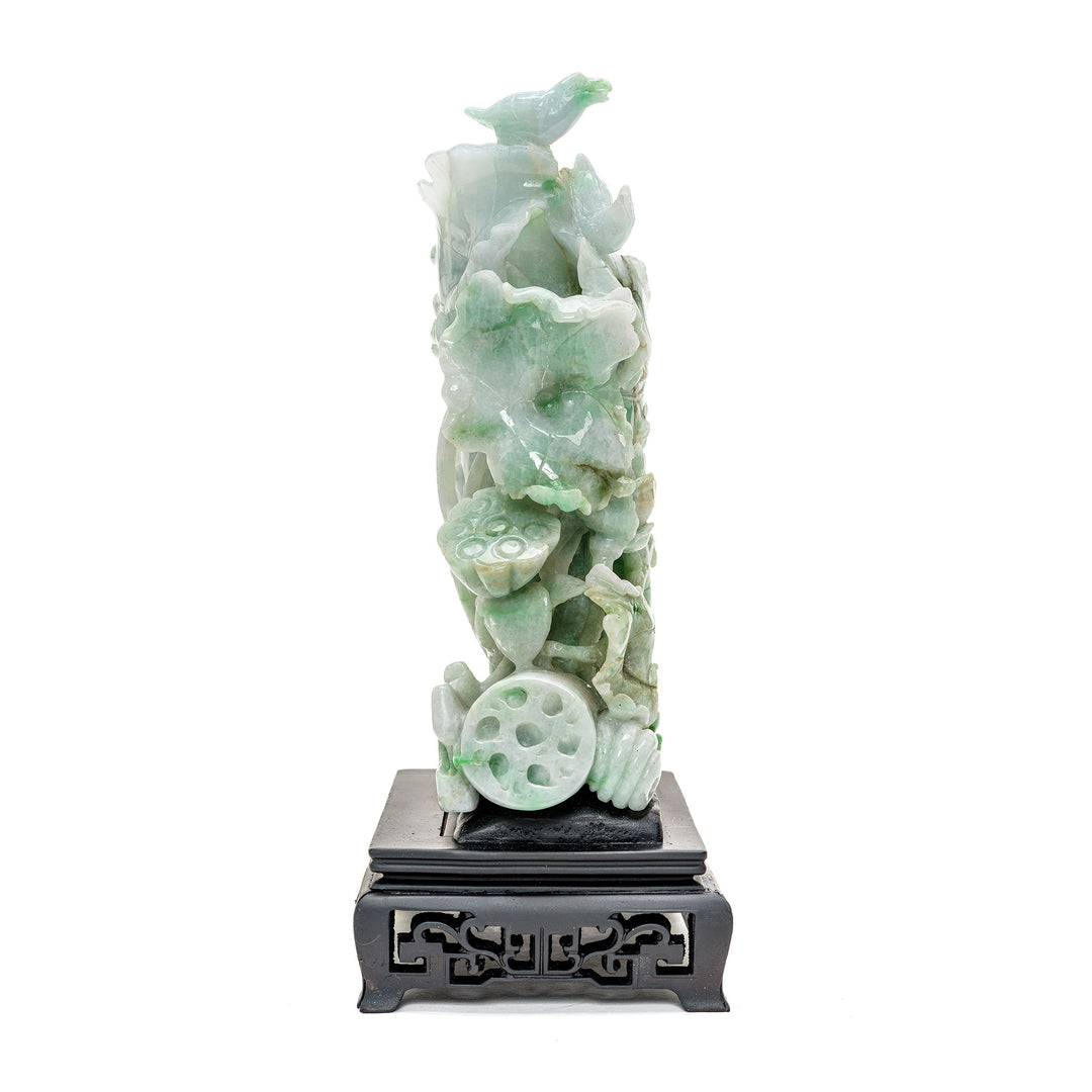 Detailed jadeite flora and fauna artwork on a traditional base.