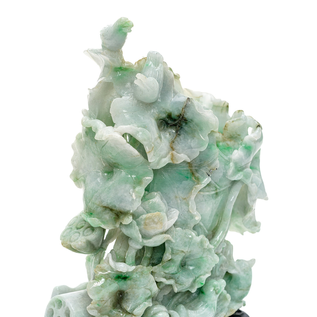 Heirloom jadeite sculpture with meticulous nature-inspired design.