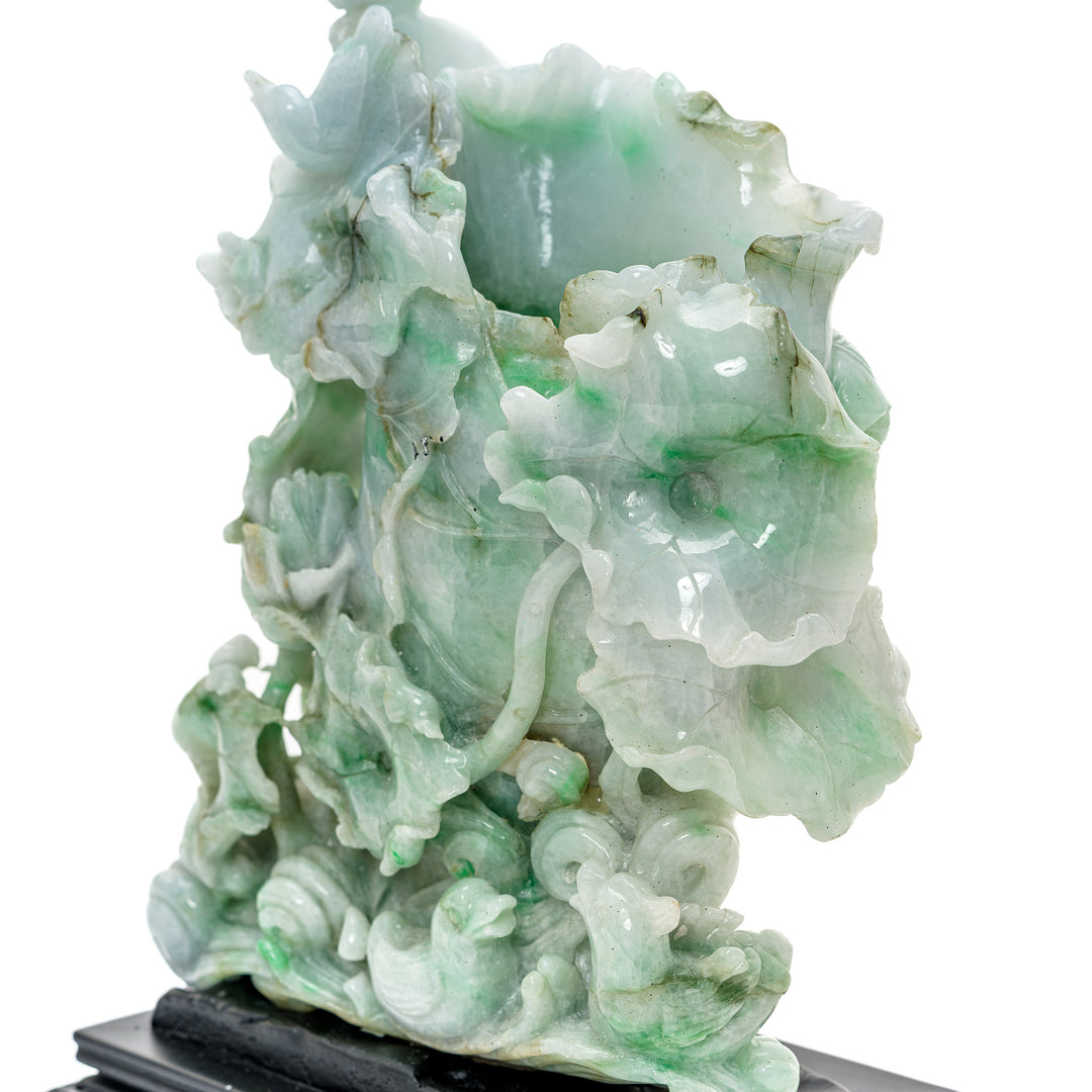 Heirloom jadeite sculpture with meticulous nature-inspired design.