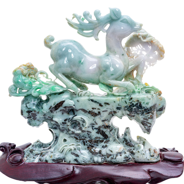 Pair of jade reindeer with spinach green and russet highlights, evoking nature's splendor