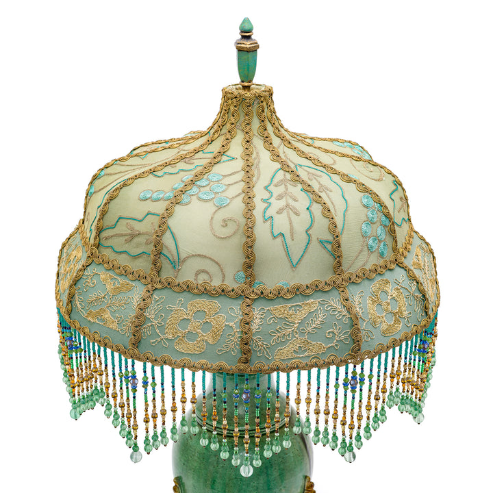 Artisanal bronze lamp with ornate hand embroidery from the early 1900s.